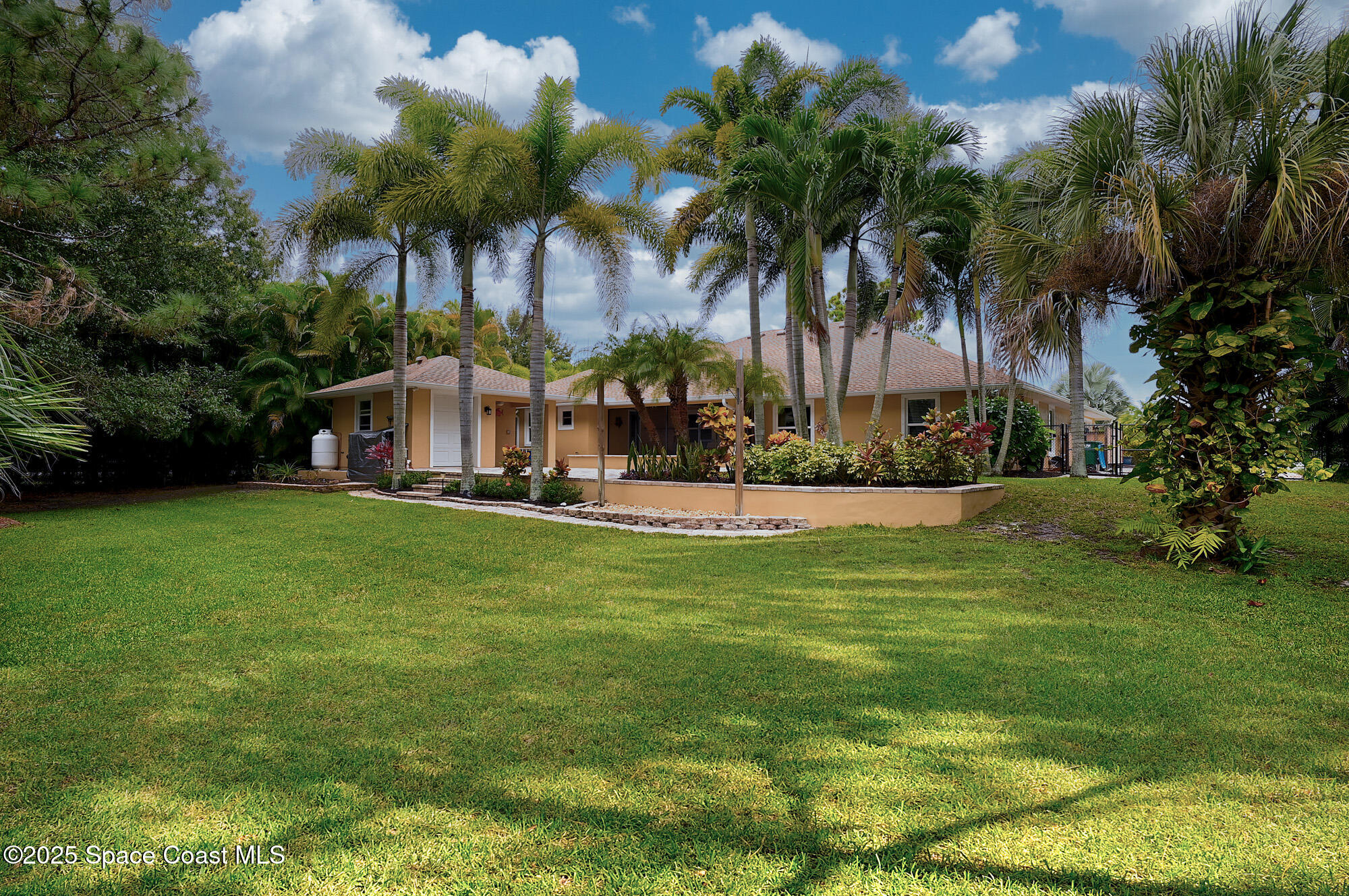 4580 Hunters Run Circle Grant, FL 32949 - Photo 19 of 55 a view of a swimming pool with a garden