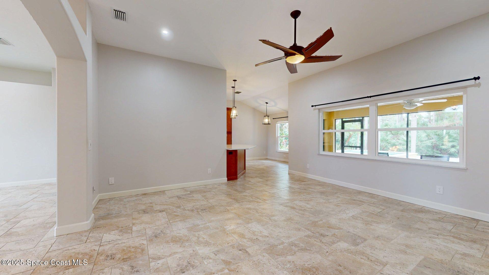 4580 Hunters Run Circle Grant, FL 32949 - Photo 22 of 55 a view of a livingroom with a ceiling fan and window