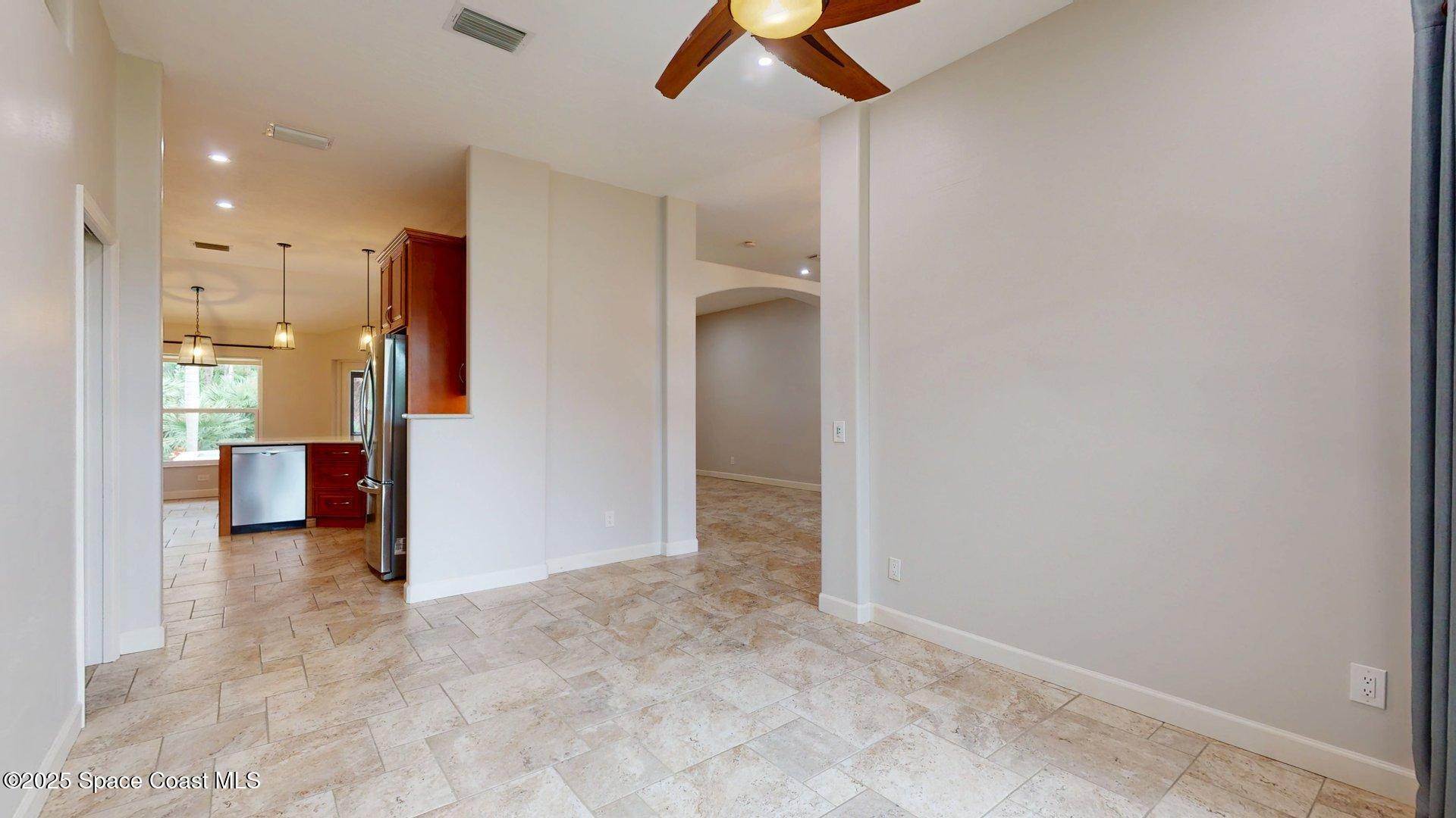 4580 Hunters Run Circle Grant, FL 32949 - Photo 36 of 55 an empty room with a cabinet and mirrors