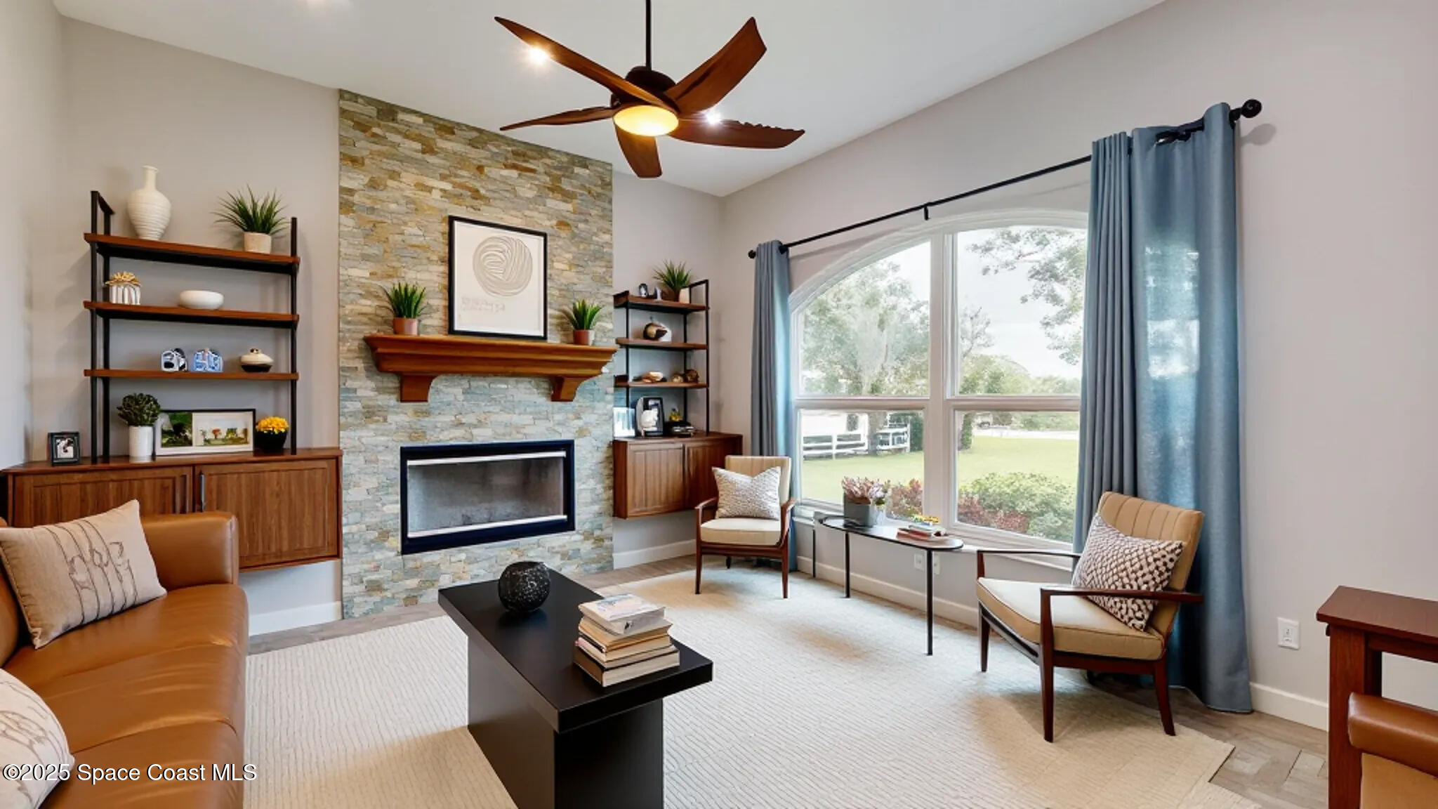 4580 Hunters Run Circle Grant, FL 32949 - Photo 38 of 55 a living room with furniture a fireplace and a large window