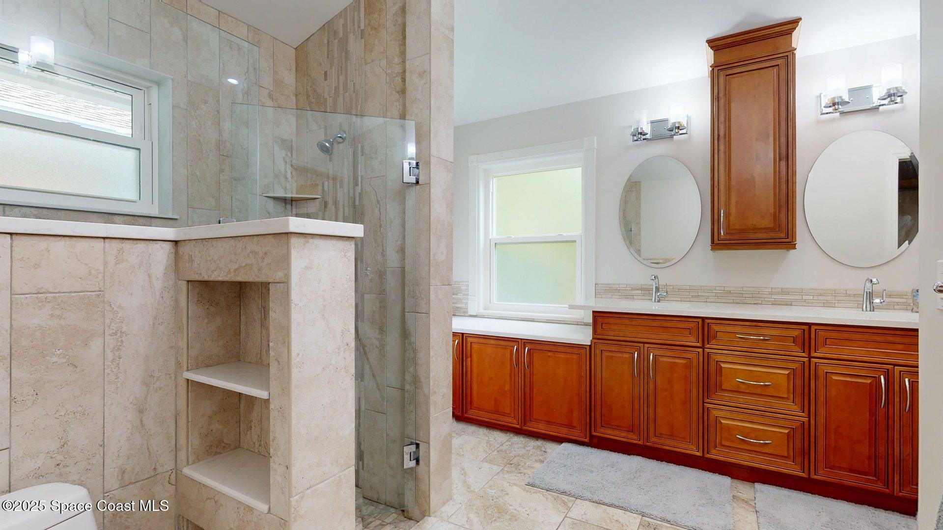 4580 Hunters Run Circle Grant, FL 32949 - Photo 45 of 55 a bathroom with a sink a mirror and a shower