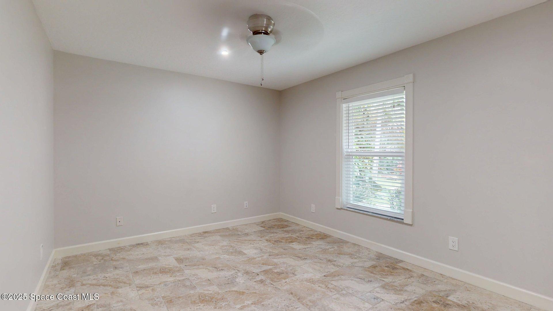 4580 Hunters Run Circle Grant, FL 32949 - Photo 47 of 55 an empty room with a empty space and windows