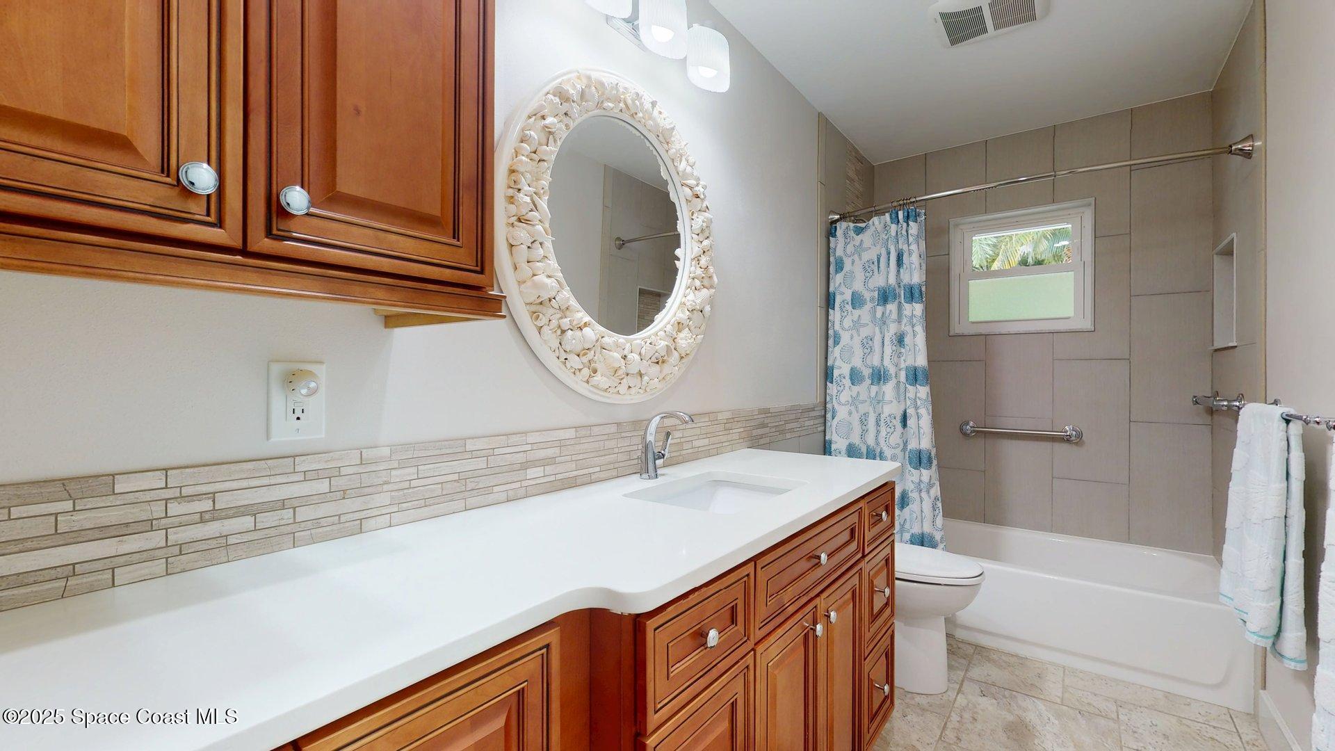 4580 Hunters Run Circle Grant, FL 32949 - Photo 49 of 55 a bathroom with a sink a toilet and bathtub