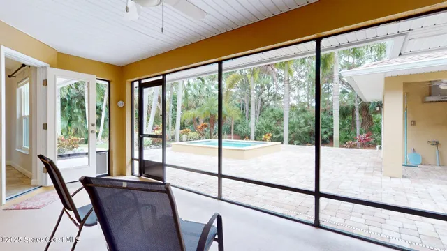 a picture of a room with a white bed