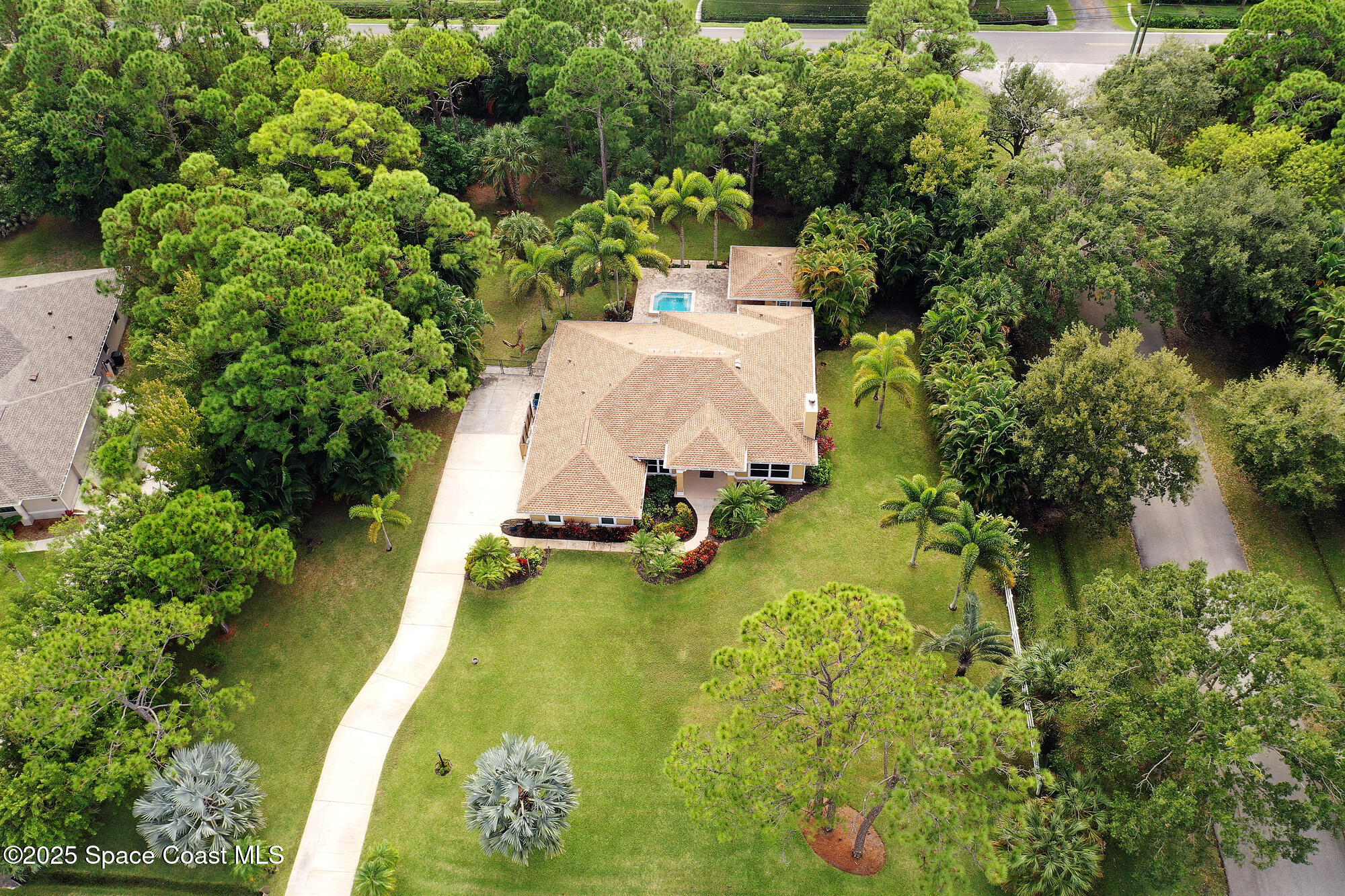 4580 Hunters Run Circle Grant, FL 32949 - Photo 7 of 55 a view of a swimming pool with a yard