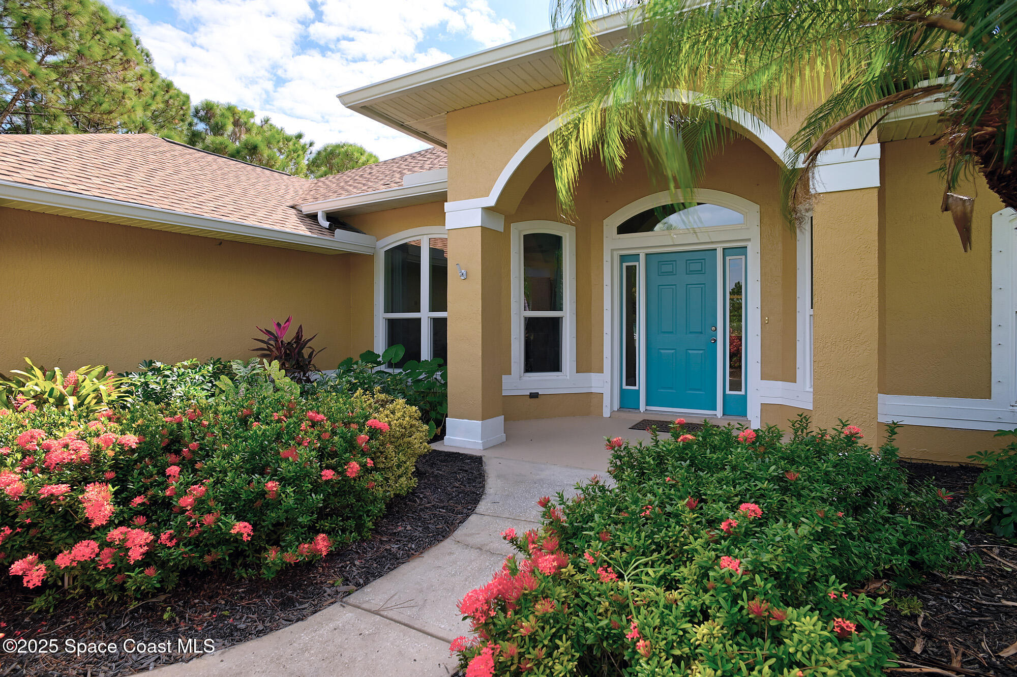 4580 Hunters Run Circle Grant, FL 32949 - Photo 9 of 55 a view of a house with a lot of flower plants