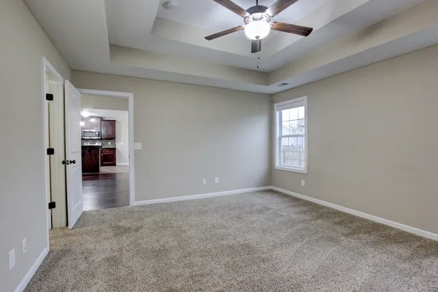 a kitchen with a table and chandelier