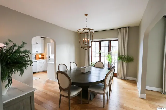 a dining room with furniture window wooden floor
