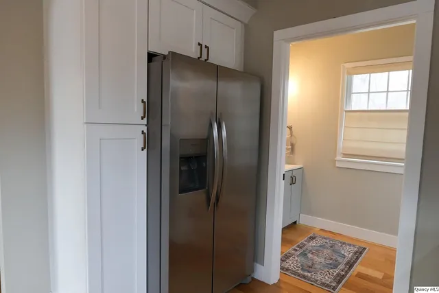 a refrigerator freezer sitting inside of a kitchen