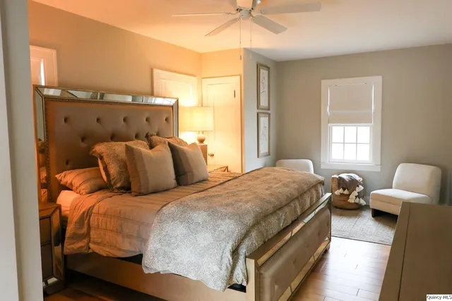 a bedroom with a bed and window