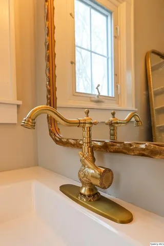 a bathroom with a tub and sink