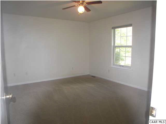 609 East Daffodil Road Ruckersville, VA 22968 - Photo 9 of 12 an empty room with a window and a fan