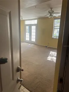 a view of empty room with windows