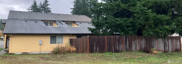 a front view of house with garden