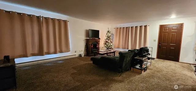 a living room with furniture window and a window