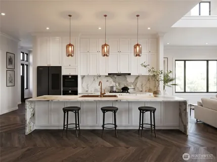 a kitchen with stainless steel appliances granite countertop a stove and white cabinets