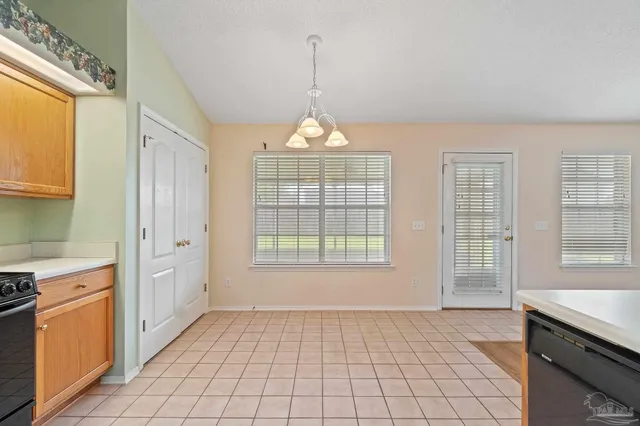 a open kitchen with a sink stove and cabinets