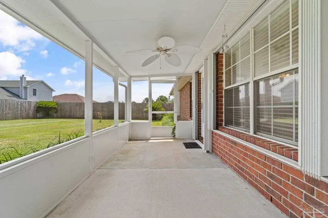 a view of a house with a big yard and potted plants