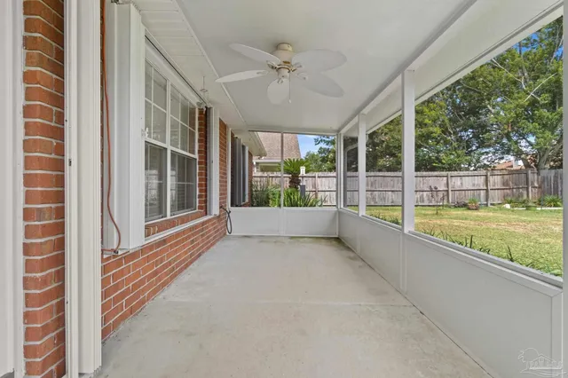 a view of a porch with a floor to ceiling window and a swimming pool