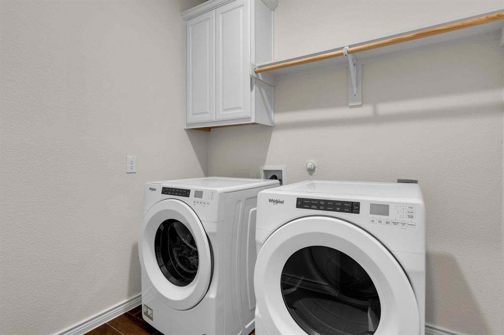 3106 Maverick Drive Forney, TX 75126 - Photo 13 of 32 a utility room with dryer and washer