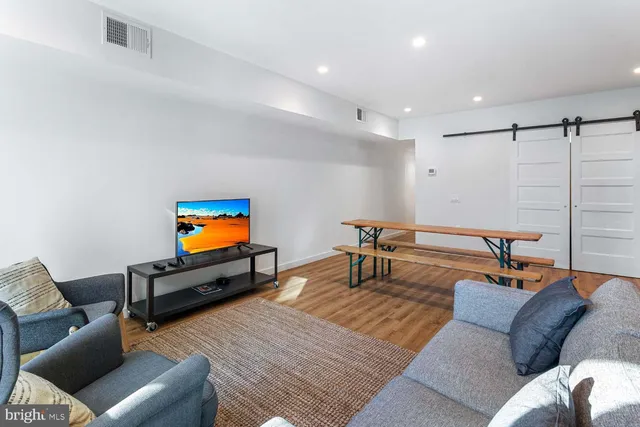 a living room with furniture and a table