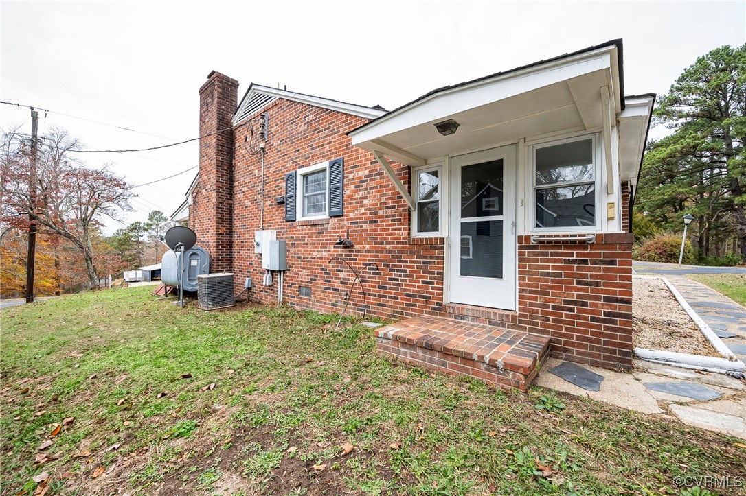 2100 Mt Landing Road Tappahannock, VA 22560 - Photo 24 of 31 View of front of home with central AC unit and a f
