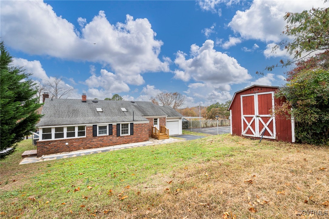 2100 Mt Landing Road Tappahannock, VA 22560 - Photo 28 of 31 Back of property with a shed and a yard