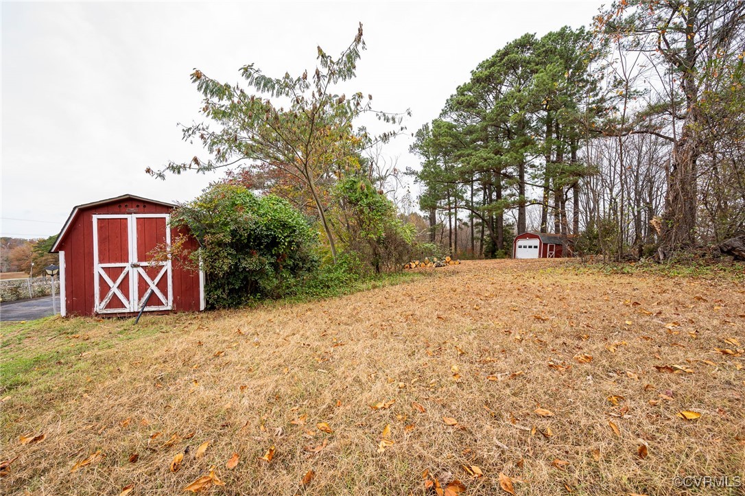 2100 Mt Landing Road Tappahannock, VA 22560 - Photo 29 of 31 View of yard featuring a storage unit