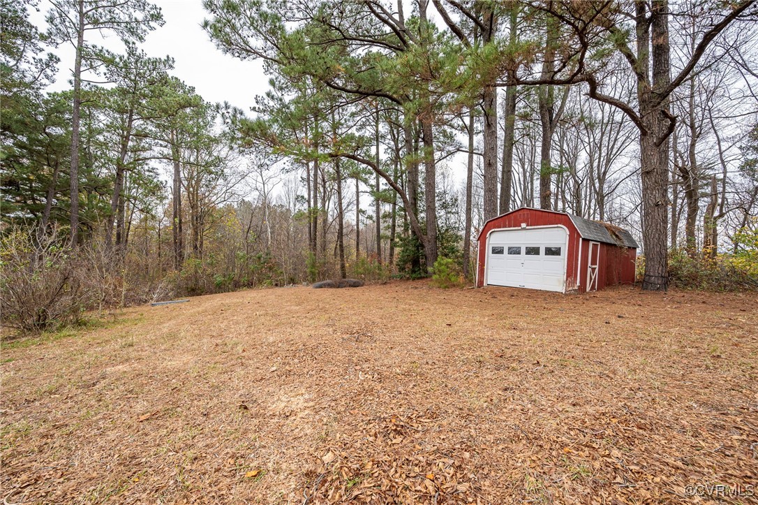 2100 Mt Landing Road Tappahannock, VA 22560 - Photo 30 of 31 View of yard with an outbuilding and a garage