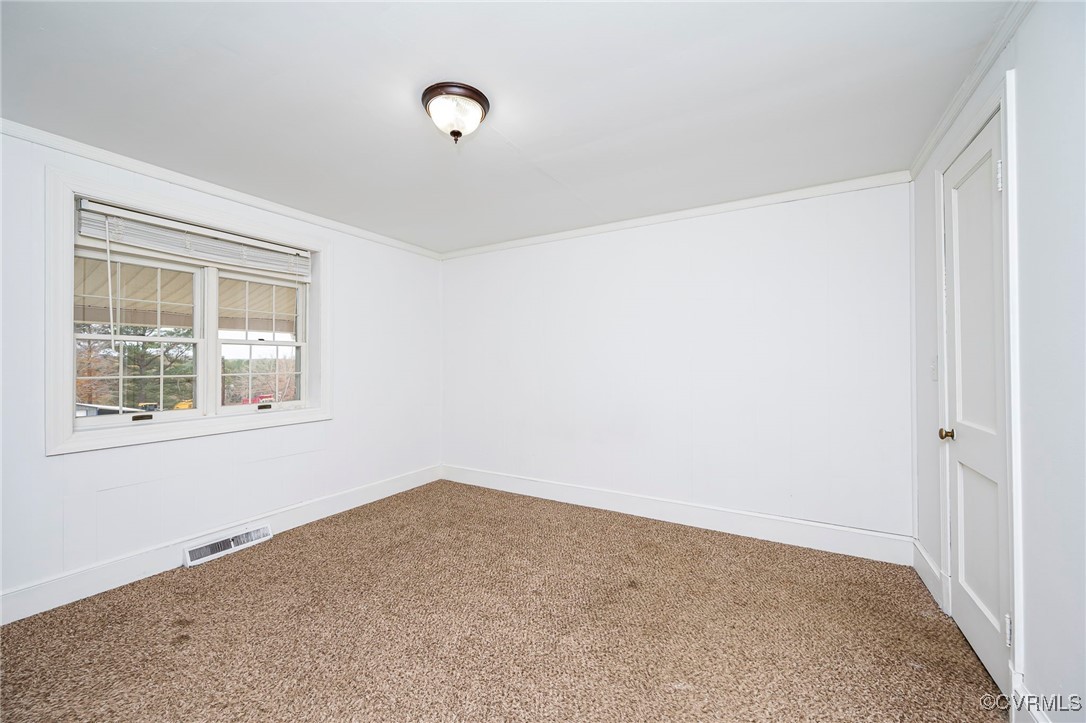 Spare room with carpet floors