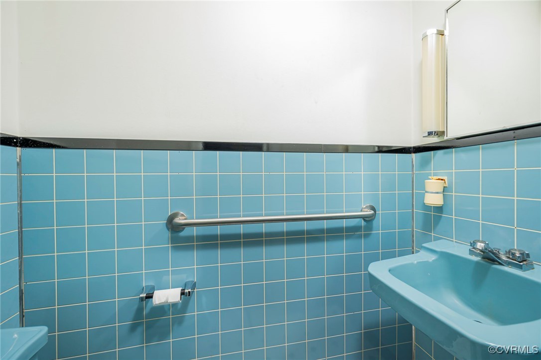 2100 Mt Landing Road Tappahannock, VA 22560 - Photo 9 of 31 Bathroom with sink and tile walls