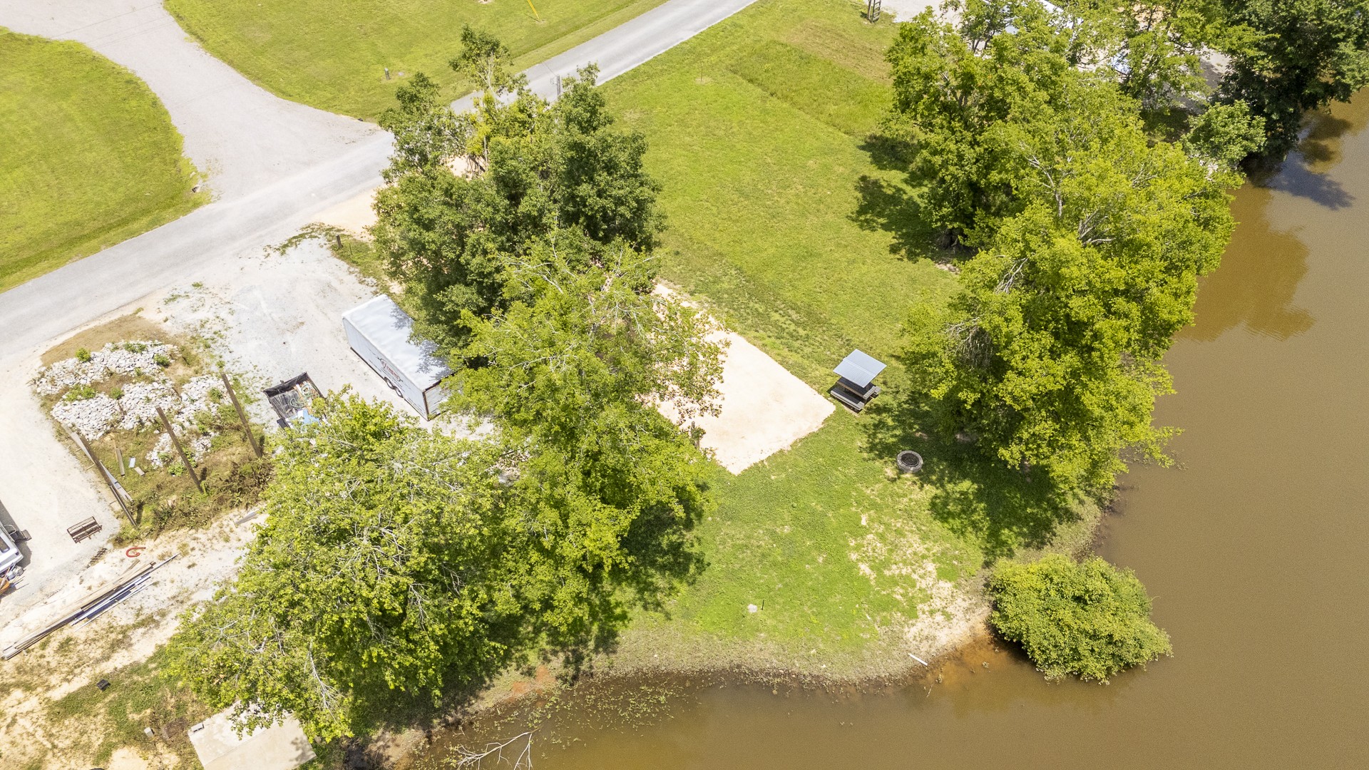 264 Duck Blind Road Clifton, TN 38425 - Photo 2 of 14 a view of a garden with a lake