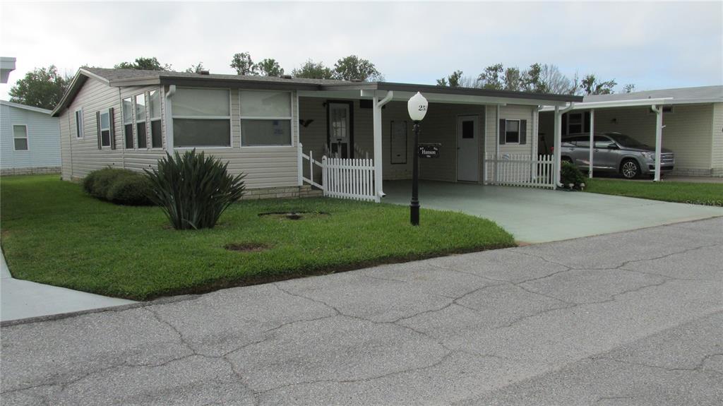 a view of a front of a house with a yard