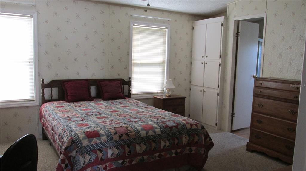 253 Ramsgate Way Haines City, FL 33844 - Photo 13 of 21 a bedroom with a bed and a closet