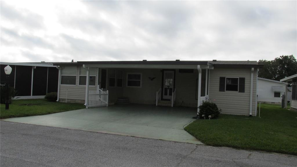 253 Ramsgate Way Haines City, FL 33844 - Photo 2 of 21 a view of a house with a backyard