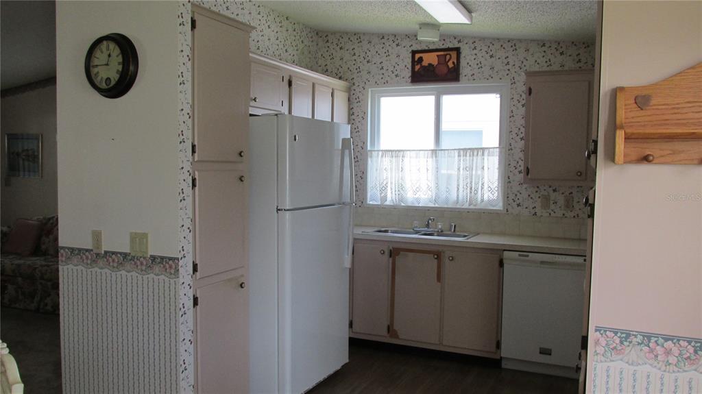 253 Ramsgate Way Haines City, FL 33844 - Photo 8 of 21 a kitchen with stainless steel appliances a refrigerator and a window