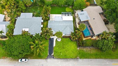an aerial view of a house with a garden