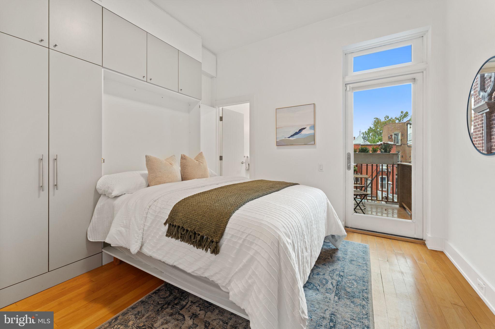 1516 R Street Northwest, Unit 3 Washington, DC 20009 - Photo 14 of 28 a bedroom with a bed and a window