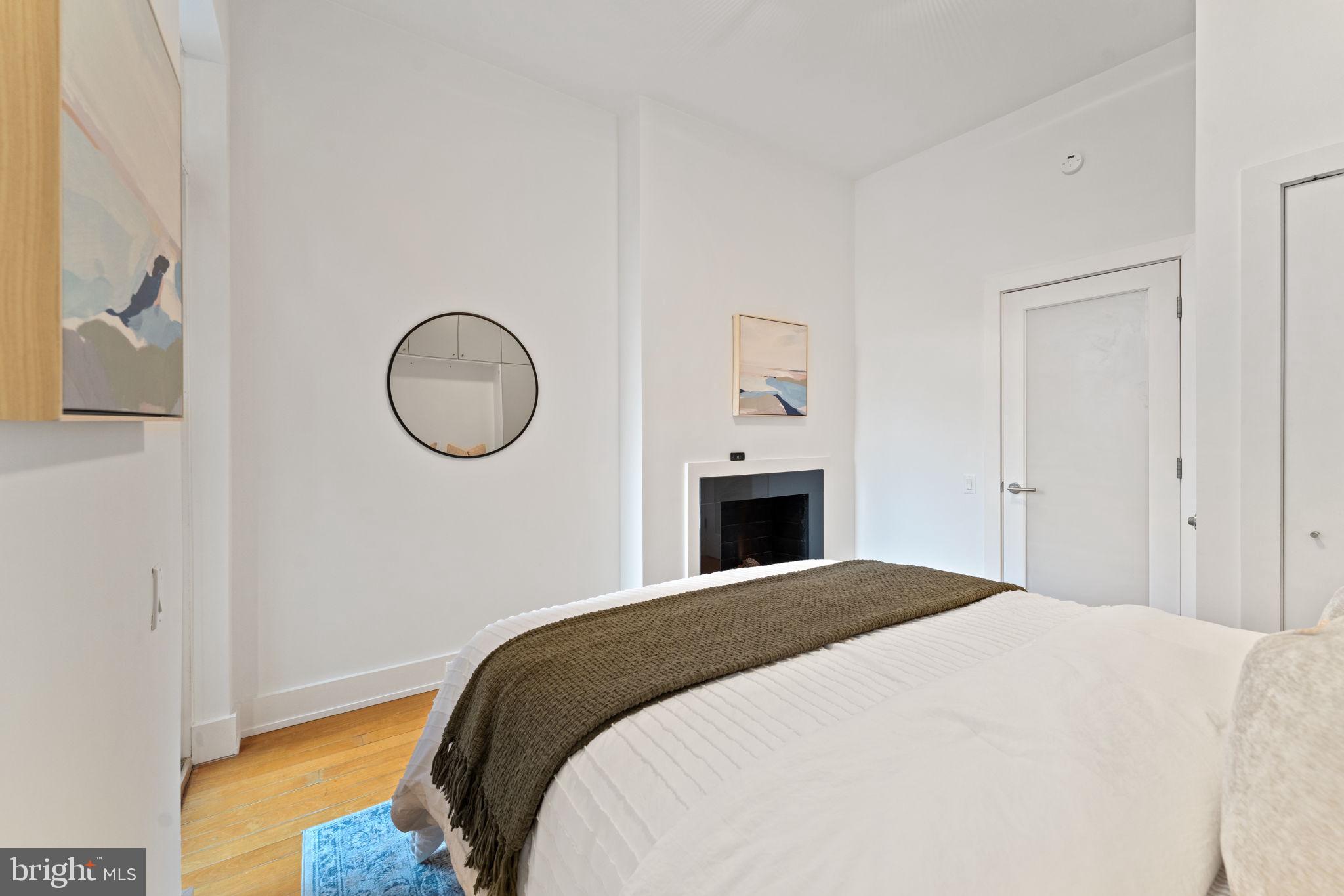 1516 R Street Northwest, Unit 3 Washington, DC 20009 - Photo 15 of 28 a bedroom with a bed and a window