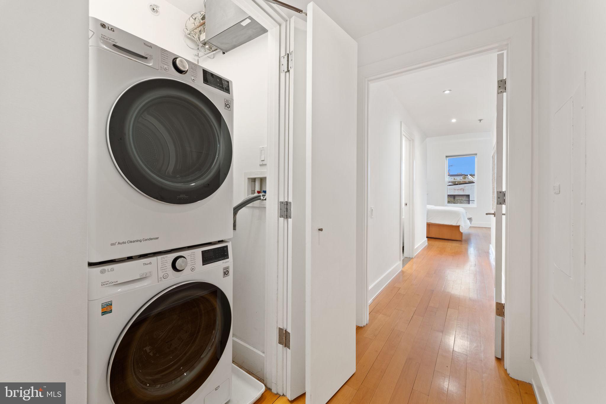 1516 R Street Northwest, Unit 3 Washington, DC 20009 - Photo 17 of 28 a view of a hallway with washer and dryer