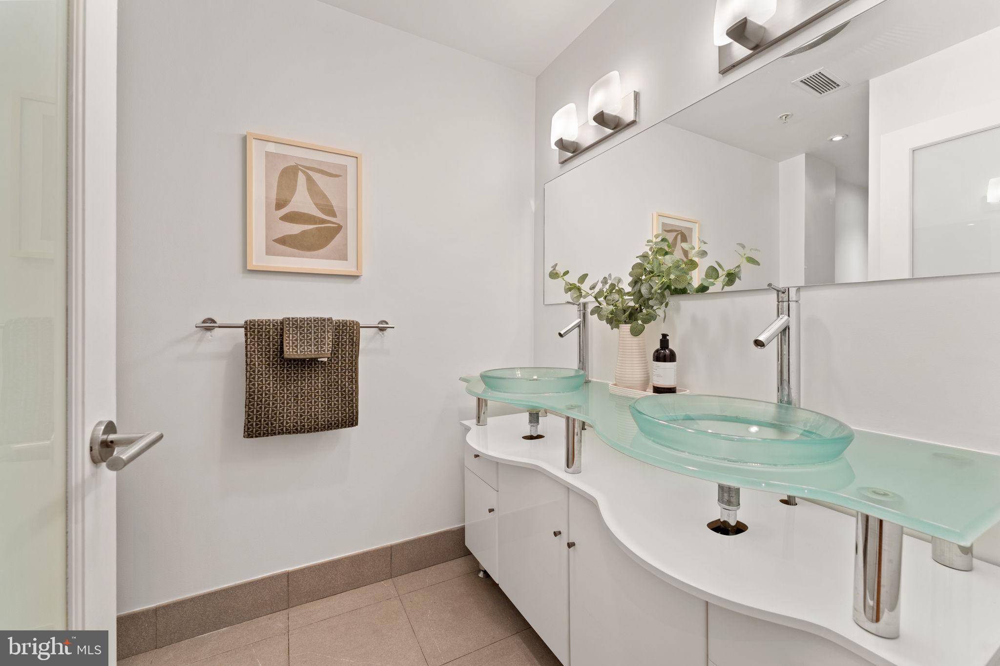 1516 R Street Northwest, Unit 3 Washington, DC 20009 - Photo 22 of 28 a bathroom with a double vanity sink and mirror