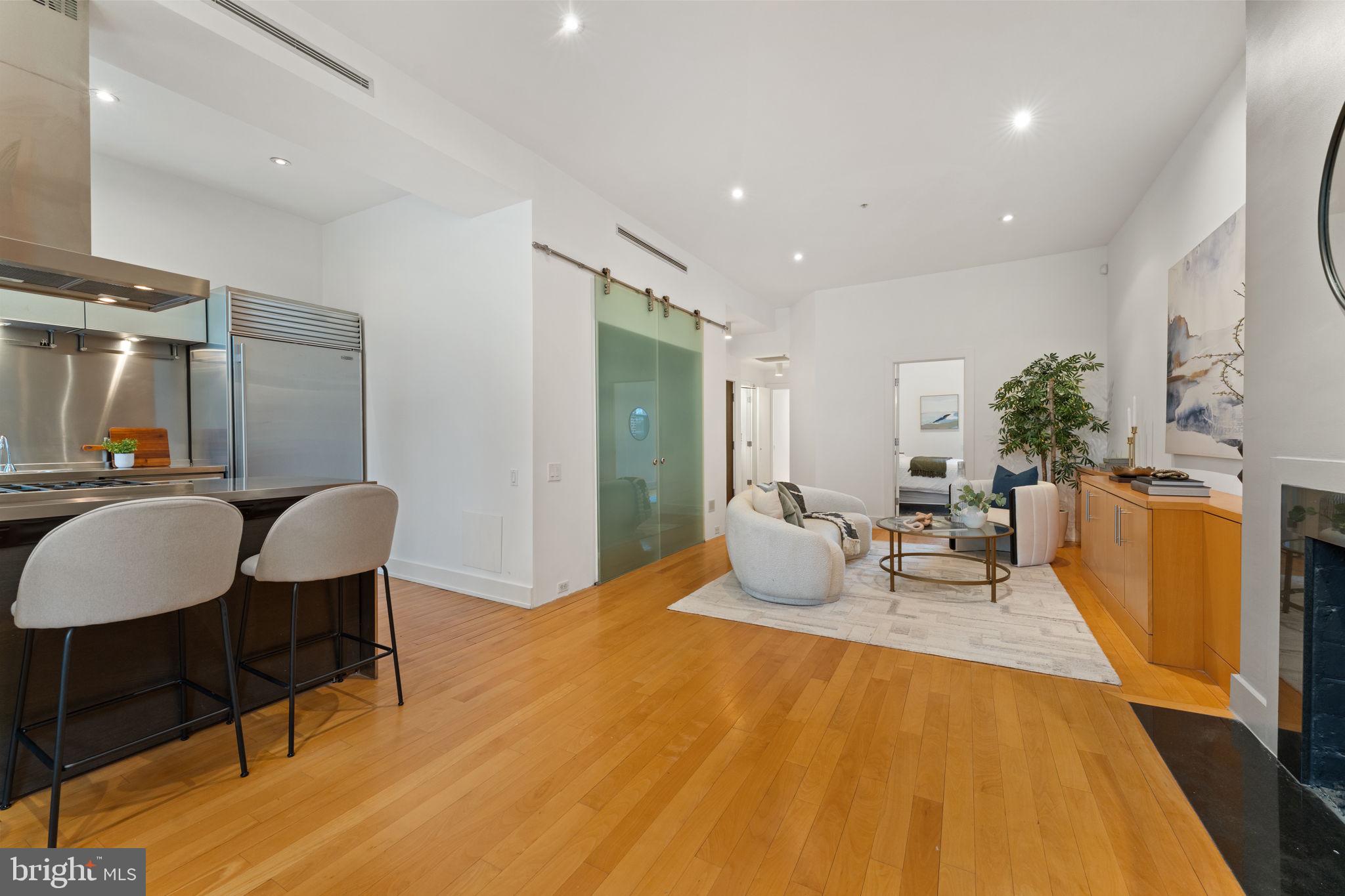 1516 R Street Northwest, Unit 3 Washington, DC 20009 - Photo 6 of 28 a living room with furniture and wooden floor