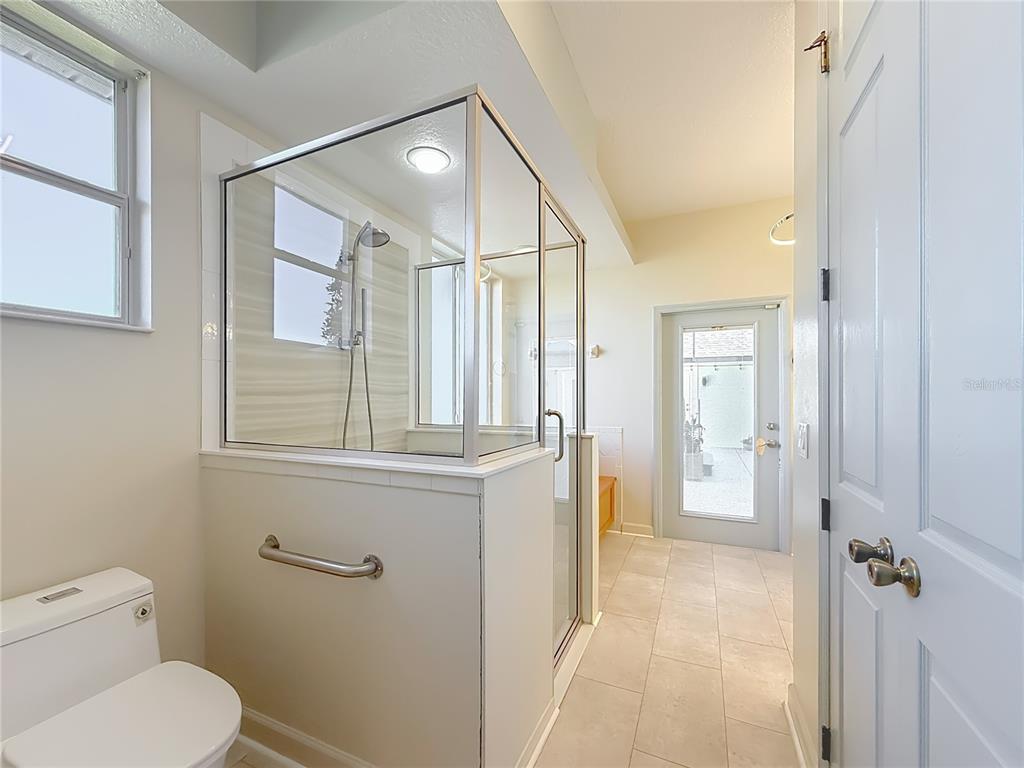 5510 Celebration Way Leesburg, FL 34748 - Photo 23 of 62 a bathroom with a toilet a sink and shower