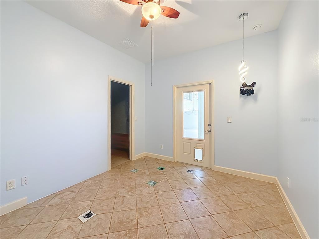 5510 Celebration Way Leesburg, FL 34748 - Photo 29 of 62 a view of an empty room with chandelier fan
