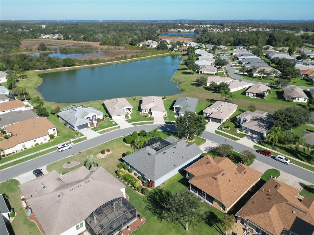 5510 Celebration Way Leesburg, FL 34748 - Photo 45 of 62 an aerial view of a house with a lake view
