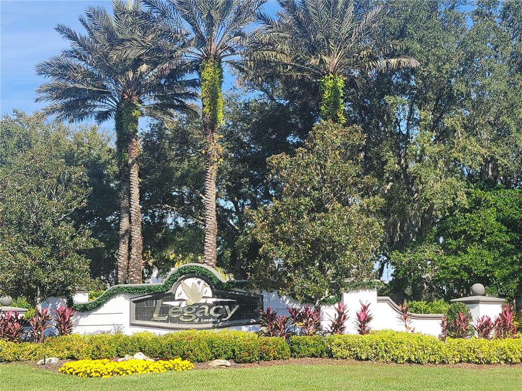 5510 Celebration Way Leesburg, FL 34748 - Photo 48 of 62 a front view of a house with a yard and garage