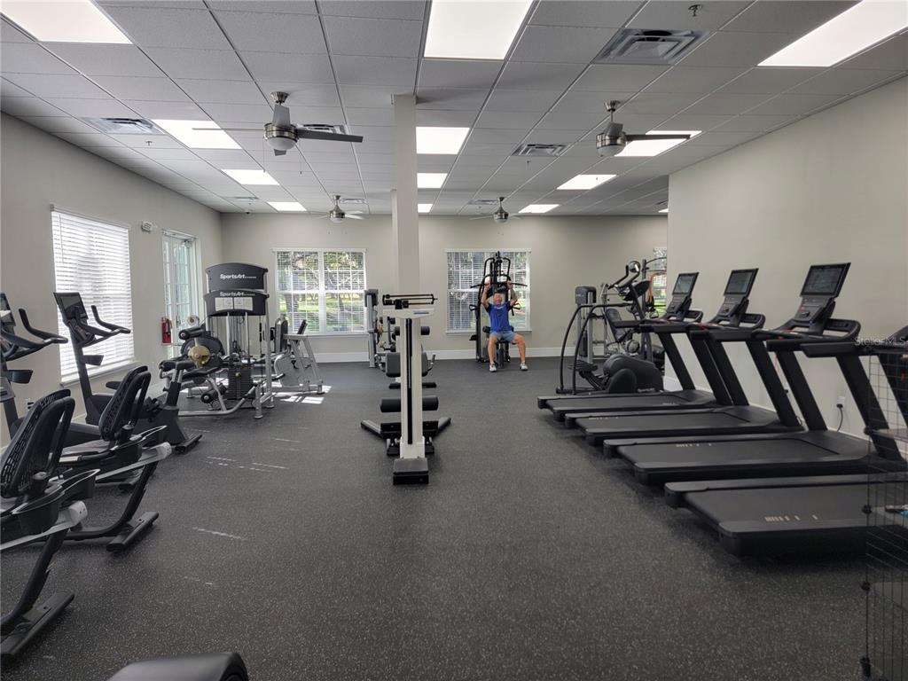 5510 Celebration Way Leesburg, FL 34748 - Photo 62 of 62 a view of a room with gym equipment