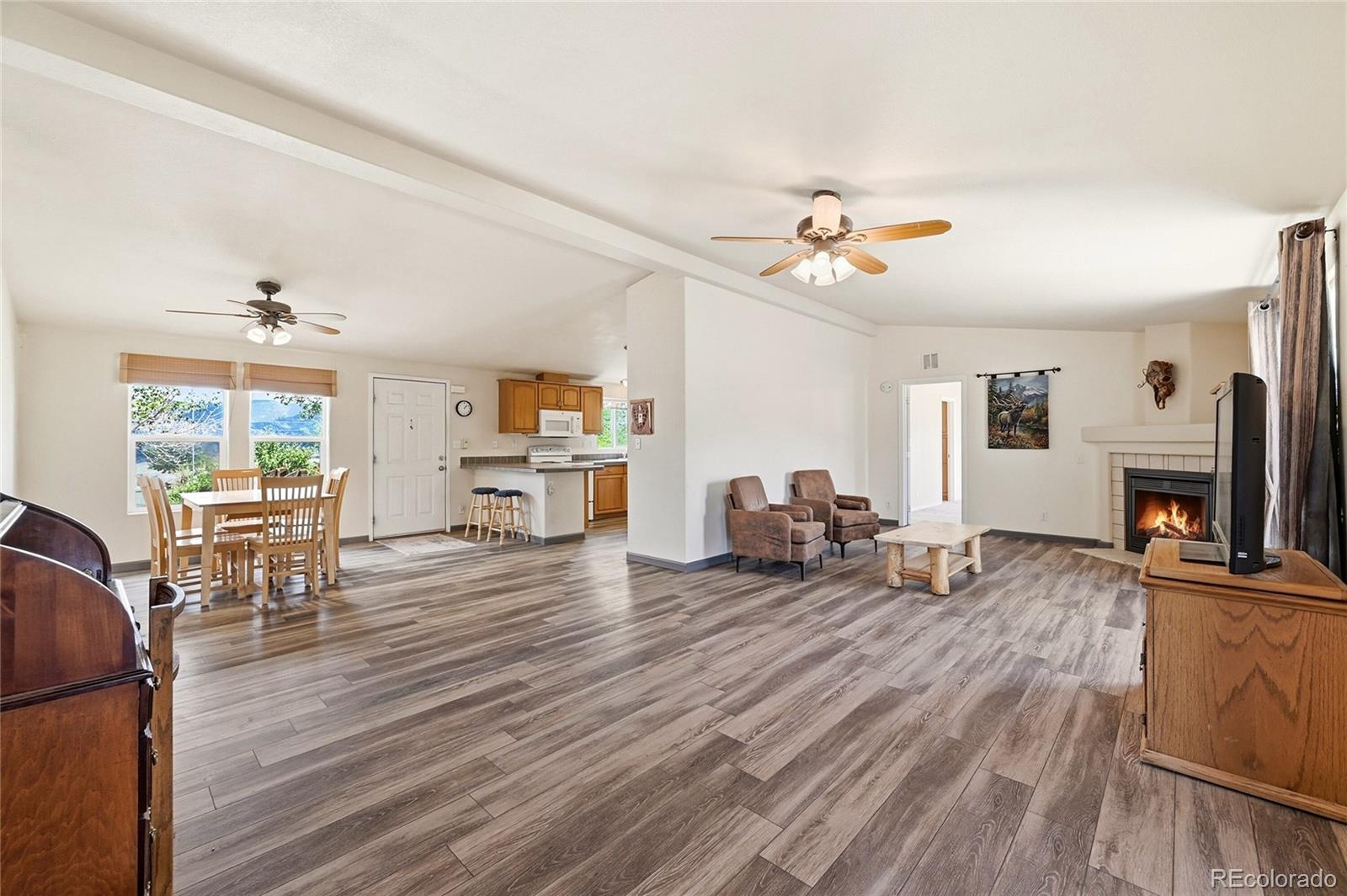 20300 Old Ranch Loop Nathrop, CO 81236 - Photo 10 of 35 a living room with furniture and a fireplace