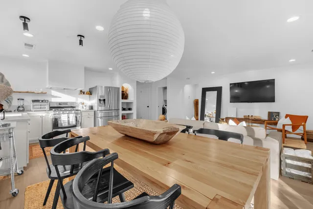 a view of a patio with swimming pool table and chairs