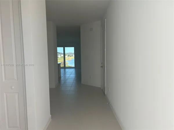 a kitchen with furniture a refrigerator and a sink